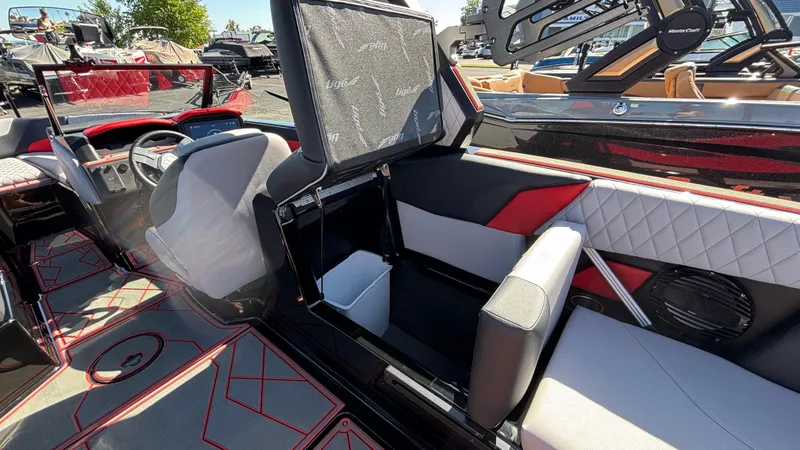 Slide: The Image of 2026 Tigé Z5 boat interior with red accents and modern seating design. - 28