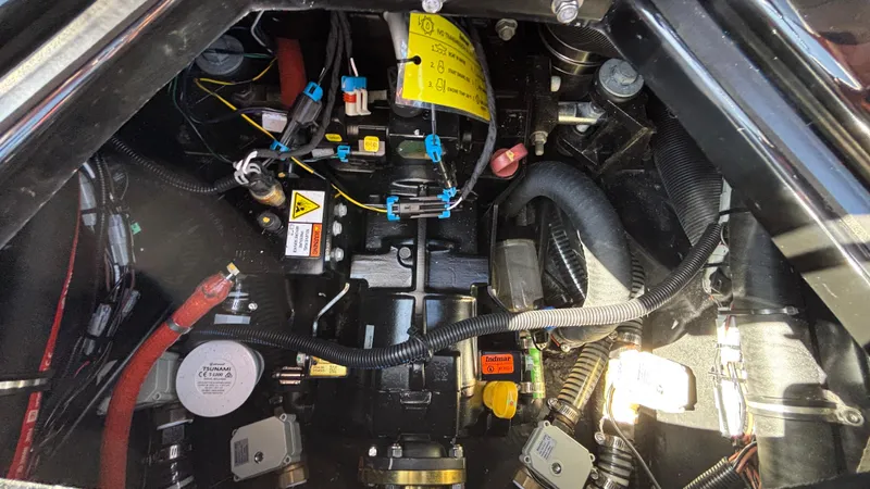 Slide: The Image of Engine compartment of a 2026 Tigé Z5 boat, showcasing wiring and components. - 33
