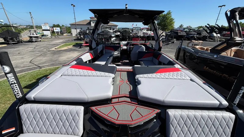 Slide: The Image of 2026 Tigé Z5 boat interior with modern seating and sleek design at a dealership. - 4