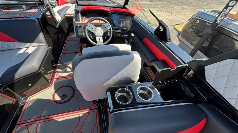Slide: The Image of 2026 Tigé Z5 boat interior with modern dashboard, steering wheel, and cup holders. - 43