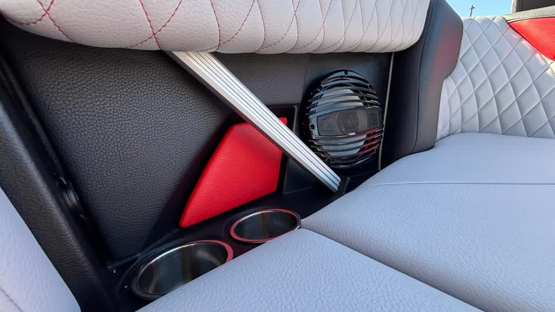 Slide: The Image of 2026 Tigé Z5 interior with quilted seats, speaker, and cup holders. - 46