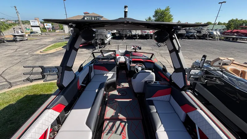 Slide: The Image of 2026 Tigé Z5 boat interior with modern seating and sleek design in a parking lot. - 6