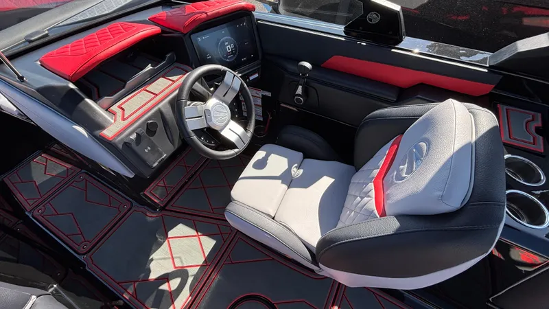Slide: The Image of 2026 Tigé Z5 boat interior with modern dashboard, steering wheel, and stylish seating. - 9