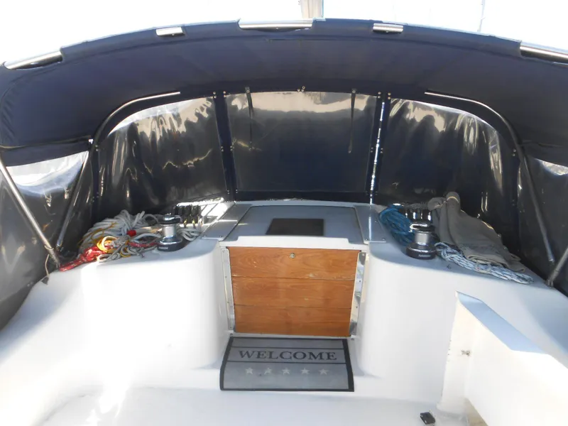 Slide: The Image of Interior of a 2004 Catalina 387 sailboat with ropes and a welcome mat. - 10