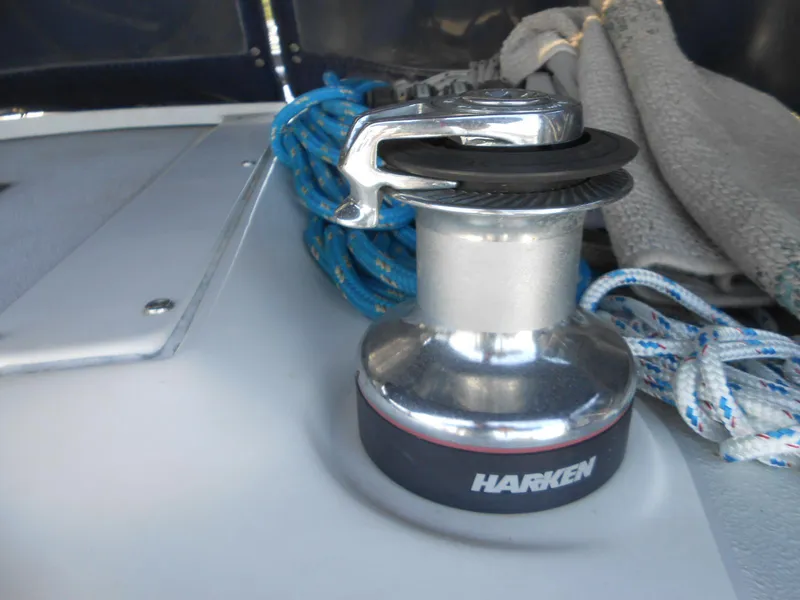 Slide: The Image of Sailboat winch on a 2004 Catalina 387 with ropes and Harken branding. - 13