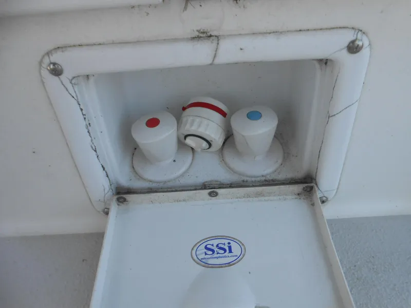 Slide: The Image of Water control panel on a 2004 Catalina 387 boat with red and blue knobs. - 16