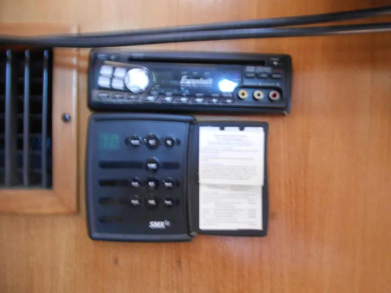 Slide: The Image of 2004 Catalina 387 interior control panel with stereo and ventilation system. - 32