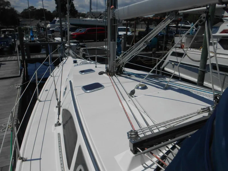 Slide: The Image of 2004 Catalina 387 sailboat deck with rigging at marina. - 35