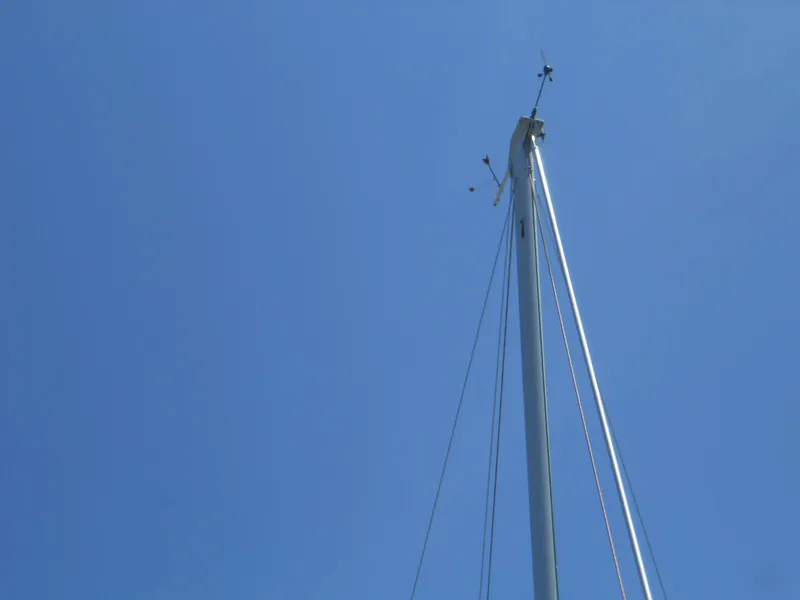 Slide: The Image of Mast of 2004 Catalina 387 sailboat against clear blue sky. - 5