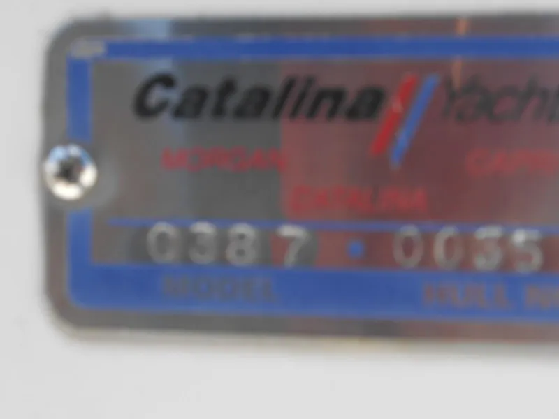 Slide: The Image of Blurry Catalina Yachts nameplate on a 2004 Catalina 387 model. - 8