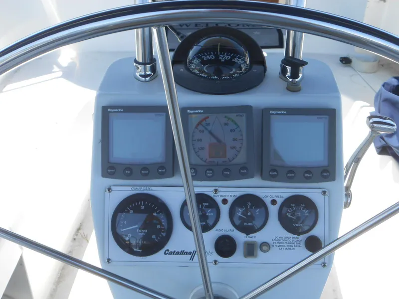 Slide: The Image of Control panel of a 2004 Catalina 387 sailboat with navigation instruments and gauges. - 9