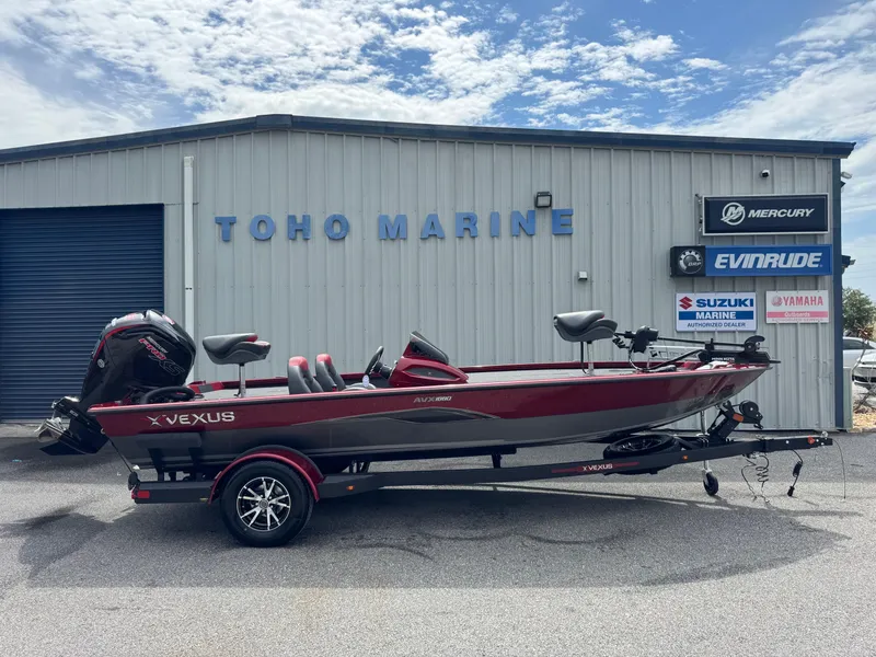 The Image of 2026 Vexus AVX1880 boat in front of Toho Marine dealership, featuring a sleek red design. - 1