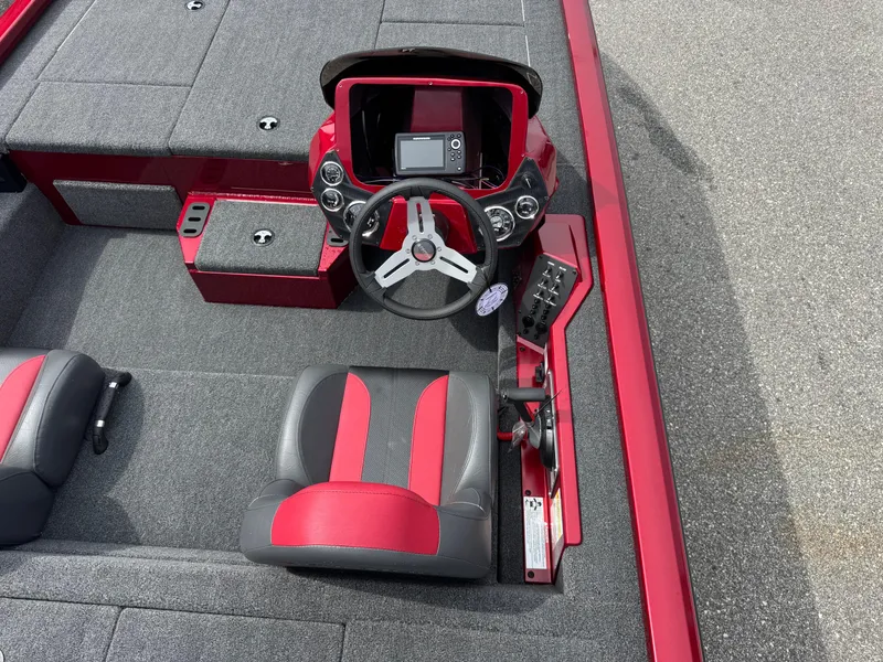 Slide: The Image of 2026 Vexus AVX1880 boat interior with red and gray seating, steering wheel, and control panel. - 14