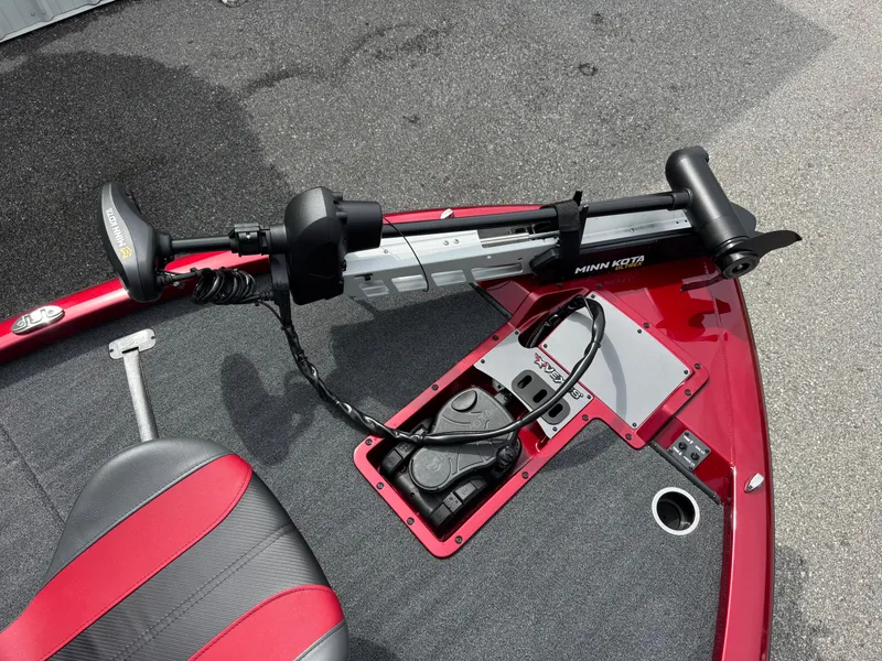 Slide: The Image of 2026 Vexus AVX1880 boat with Minn Kota trolling motor on red deck. - 7