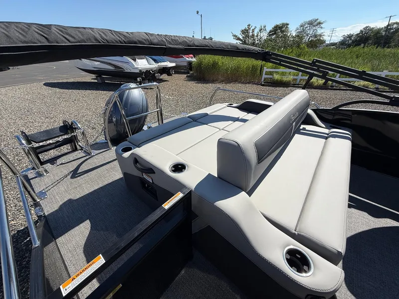 Slide: The Image of 2025 Barletta C22UC pontoon boat with spacious seating and modern design. - 14