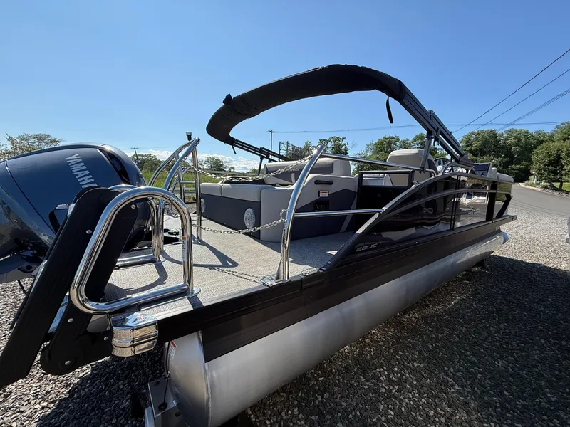 Slide: The Image of 2025 Barletta C22UC pontoon boat with Yamaha engine, sleek design, and spacious deck. - 15