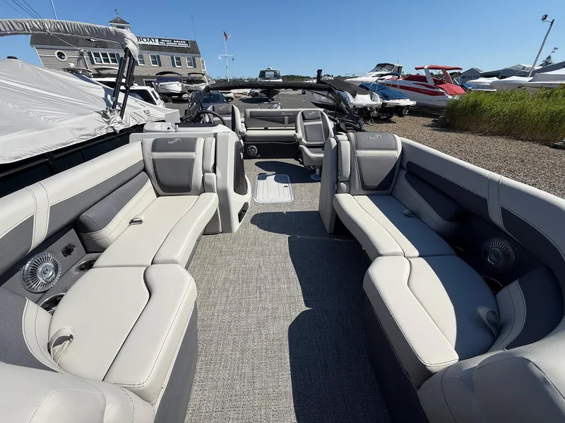 Slide: The Image of 2025 Barletta C22UC pontoon boat interior with spacious seating and modern design. - 6