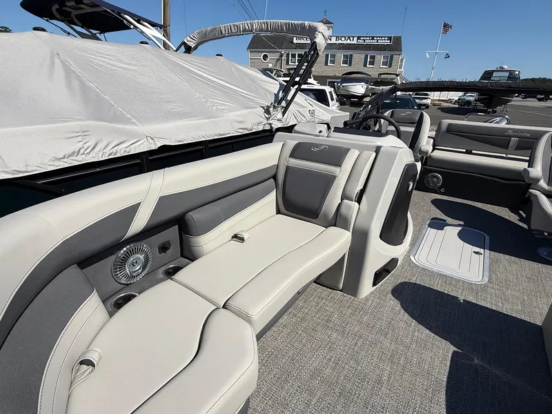 Slide: The Image of 2025 Barletta C22UC pontoon boat interior with luxurious seating and modern design. - 9