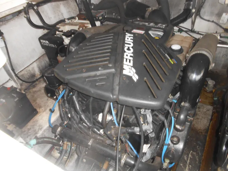 Slide: The Image of Engine compartment of a 2005 Sea Ray 340 Sundancer with Mercury engine. - 22
