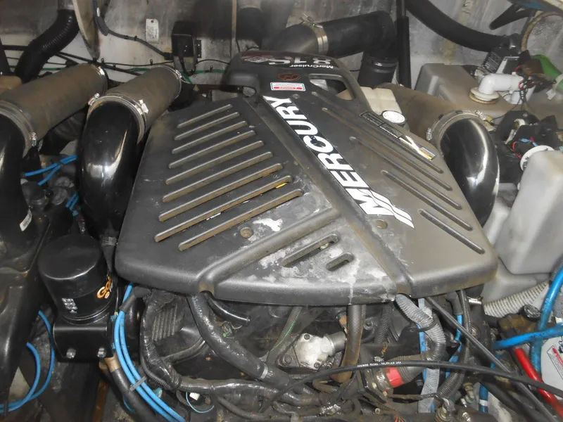 Slide: The Image of Engine compartment of a 2005 Sea Ray 340 Sundancer with Mercury components. - 23