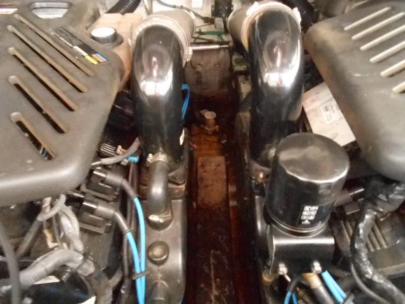 Slide: The Image of Engine compartment of a 2005 Sea Ray 340 Sundancer boat, showing mechanical components. - 24