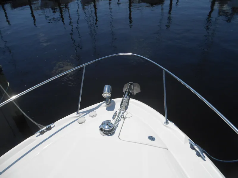 Slide: The Image of Bow of 2005 Sea Ray 340 Sundancer yacht with anchor and calm water reflection. - 28