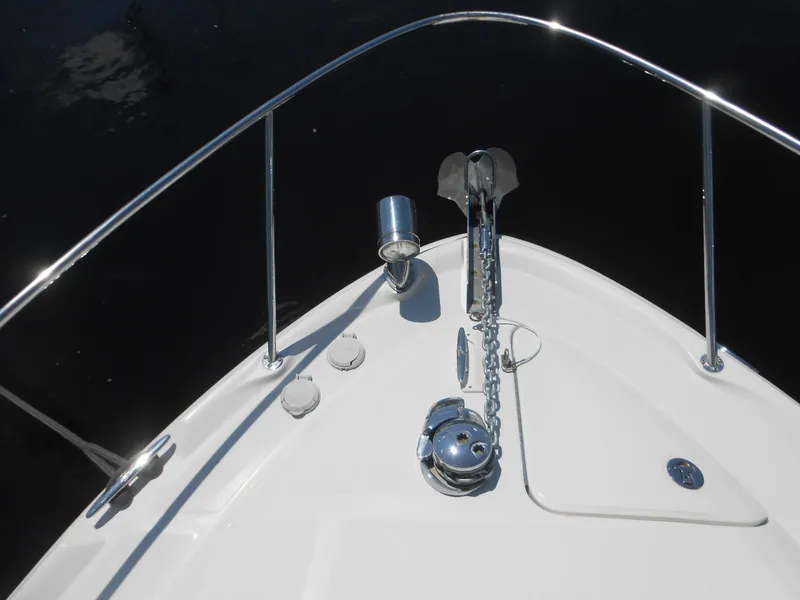 Slide: The Image of Bow of 2005 Sea Ray 340 Sundancer with anchor and railing in sunlight. - 29