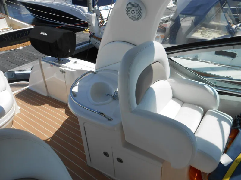 Slide: The Image of Luxurious 2005 Sea Ray 340 Sundancer boat interior with white seating and sink. - 33