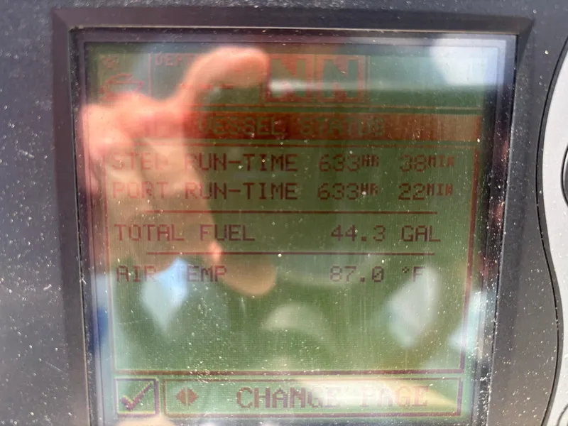 Slide: The Image of Display screen showing vessel status: engine run-time, fuel level, and air temperature on a 2005 Sea Ray 340 Sundancer. - 34