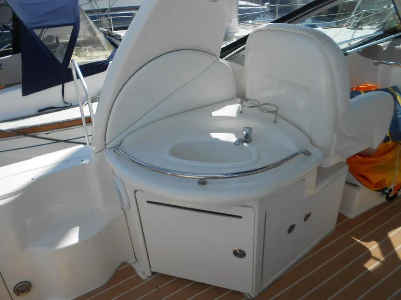 Slide: The Image of 2005 Sea Ray 340 Sundancer boat interior with sink and seating area. - 5