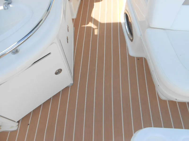 Slide: The Image of Teak deck and seating area on 2005 Sea Ray 340 Sundancer boat. - 6