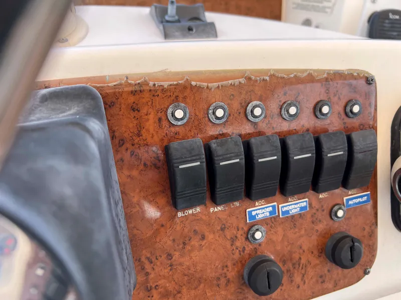 Slide: The Image of Control panel of a 2005 Silverton 38 Sport Bridge boat with switches and labels. - 22