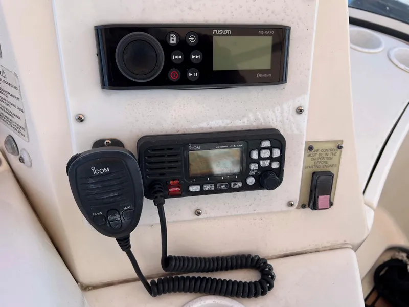 Slide: The Image of Control panel of a 2005 Silverton 38 Sport Bridge with radio and communication equipment. - 26