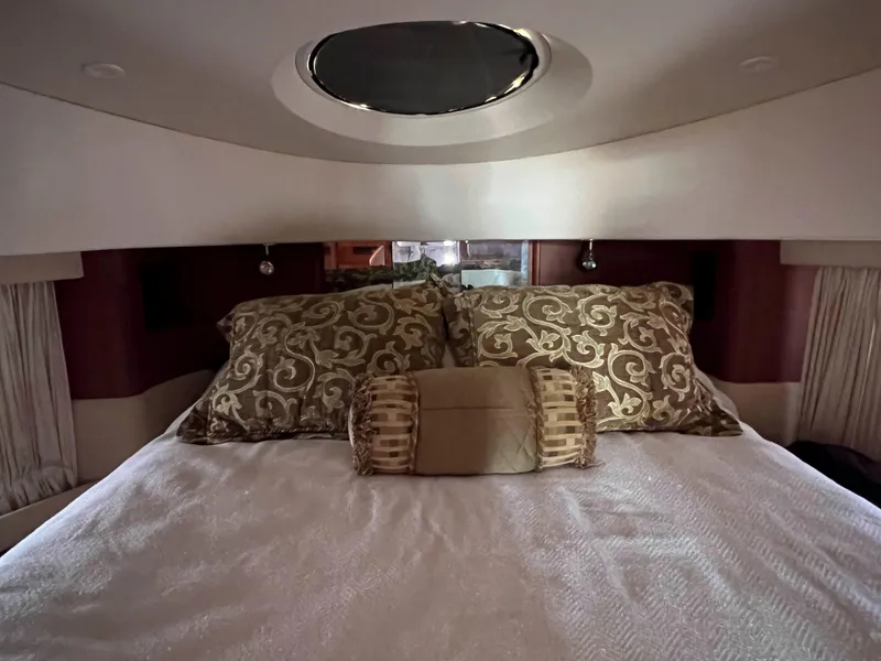 Slide: The Image of Luxurious cabin interior of 2005 Silverton 38 Sport Bridge with elegant bedding and decor. - 47
