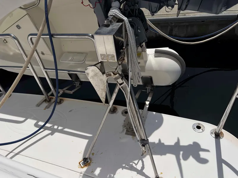 Slide: The Image of 2005 Silverton 38 Sport Bridge yacht deck with anchor and railing. - 8