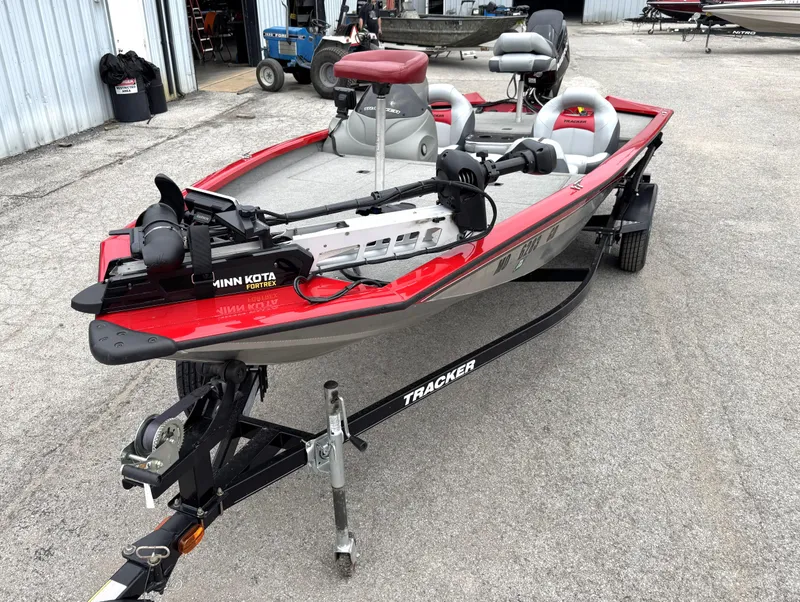 Slide: The Image of 2012 Tracker Pro Team 175 TXW fishing boat with Minn Kota Fortrex motor on trailer. - 2