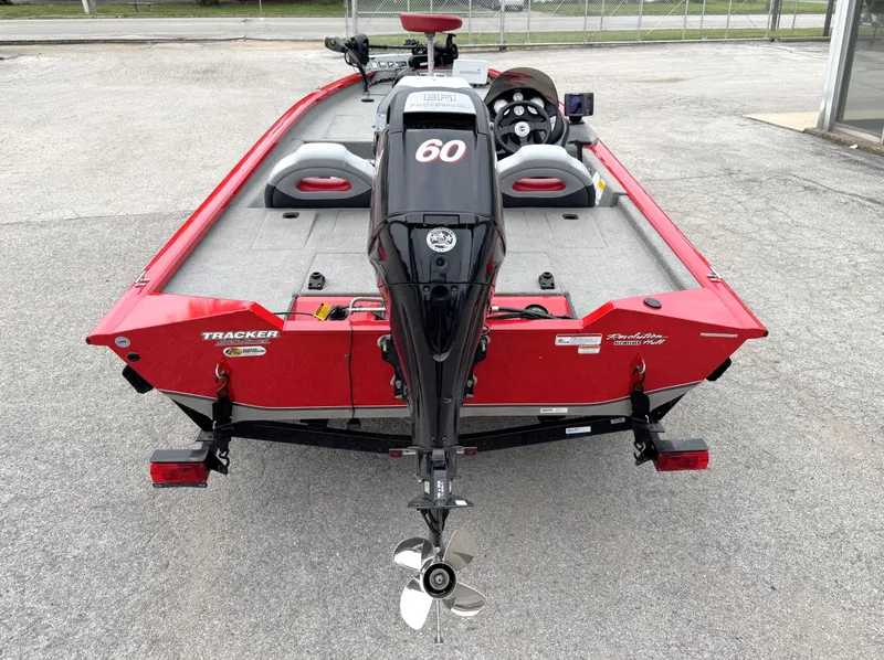 Slide: The Image of 2012 Tracker Pro Team 175 TXW boat, red, rear view with motor and seating. - 6