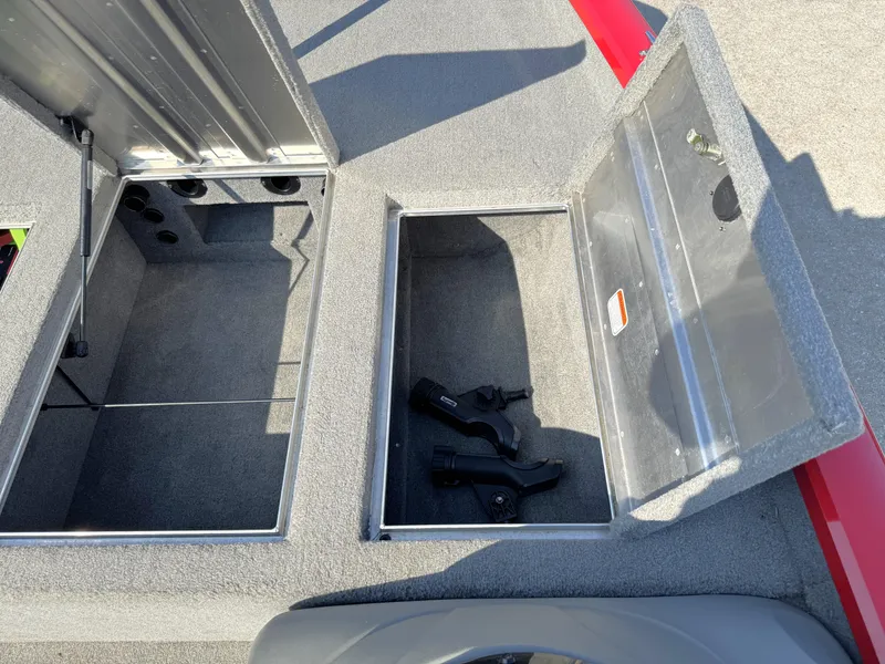 Slide: The Image of Open storage compartments on a 2012 Tracker Pro Team 175 TXW boat. - 9