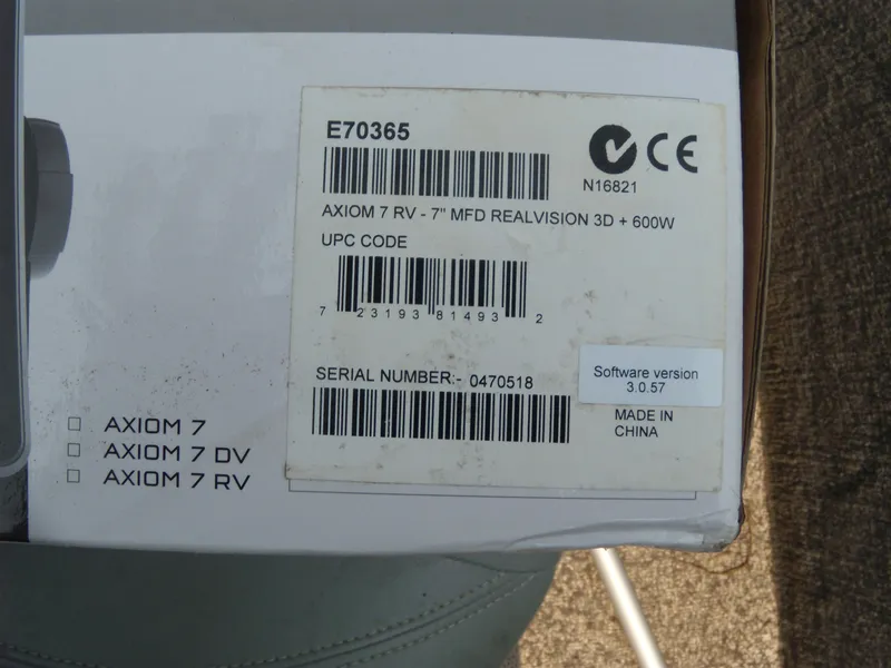Slide: The Image of Box label for Axiom 7 RV with serial number and software version details. - 13