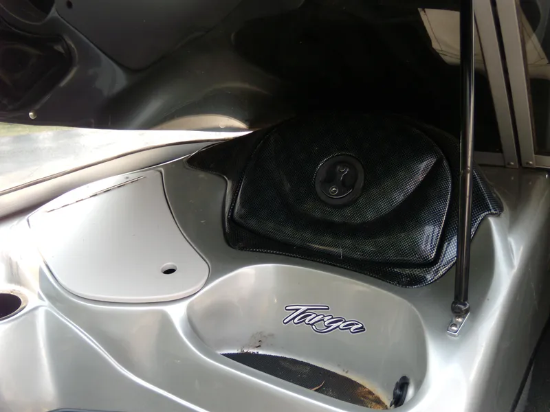 Slide: The Image of 2015 Tracker Targa V-18 WT boat interior with storage compartment and speaker. - 5