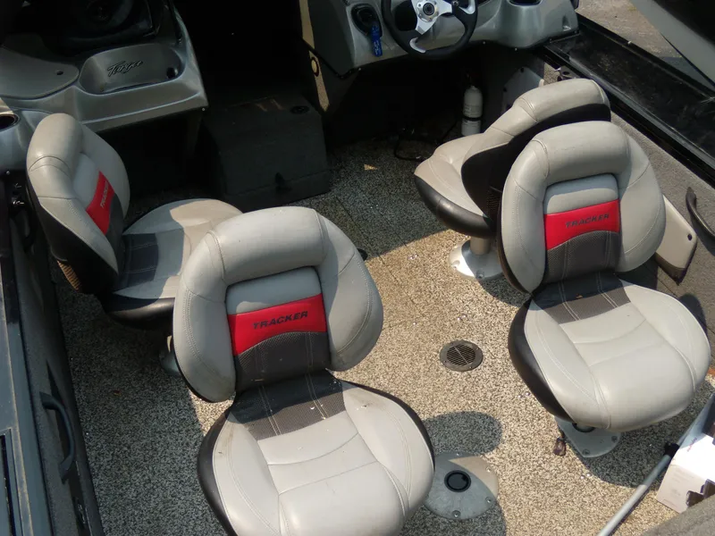 Slide: The Image of 2015 Tracker Targa V-18 WT boat interior with four seats and steering console. - 6