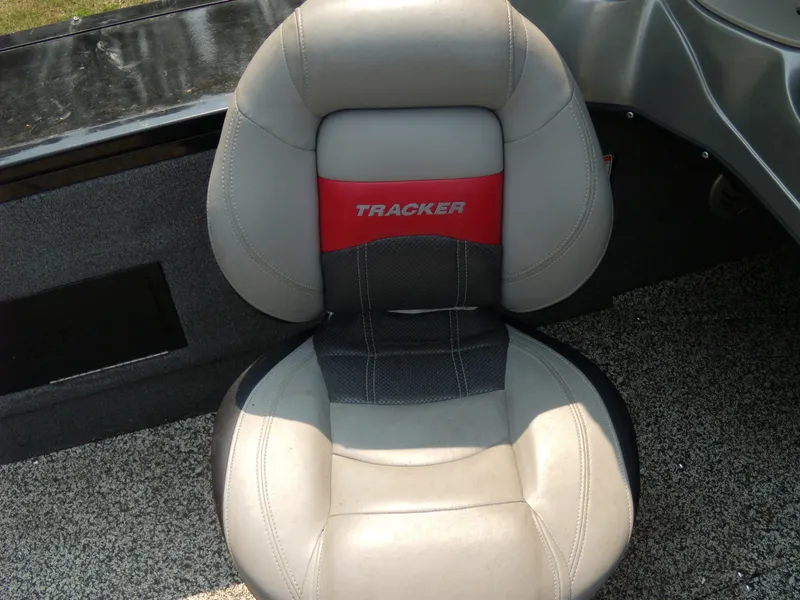Slide: The Image of 2015 Tracker Targa V-18 WT boat seat, gray and red design. - 7