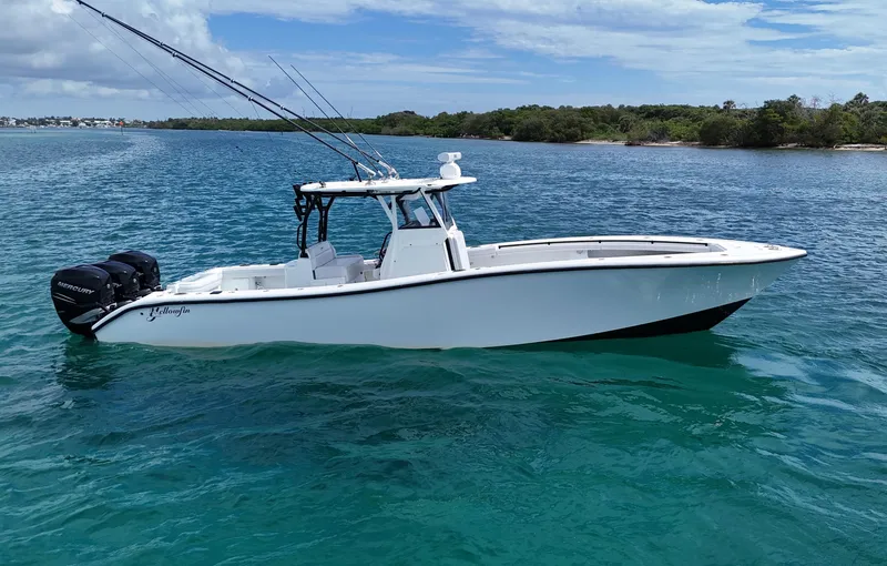 Slide: The Image of 2017 Yellowfin 36 Offshore boat on clear blue water, equipped with Mercury engines. - 1