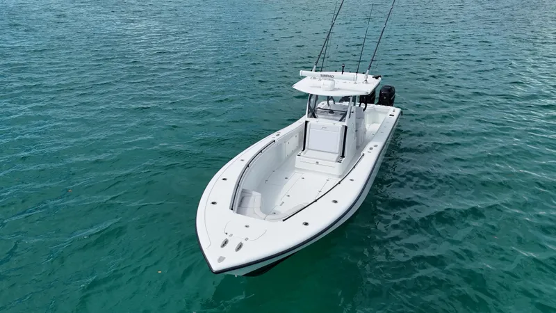 Slide: The Image of 2017 Yellowfin 36 Offshore boat on clear blue water, equipped for fishing. - 14