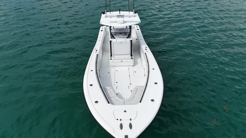 Slide: The Image of 2017 Yellowfin 36 Offshore boat on clear blue water, aerial view. - 16