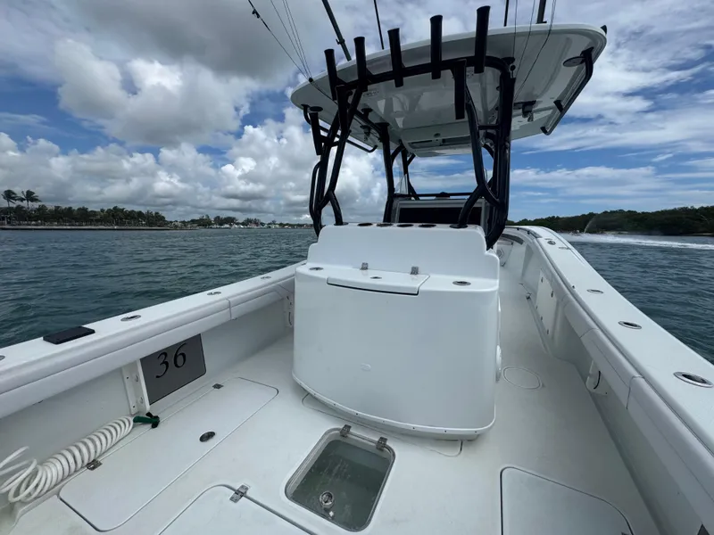 Slide: The Image of 2017 Yellowfin 36 Offshore boat on water, featuring spacious deck and fishing equipment. - 22