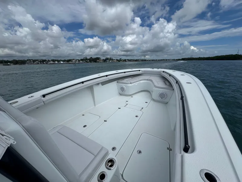 Slide: The Image of 2017 Yellowfin 36 Offshore boat on calm water under cloudy sky. - 26