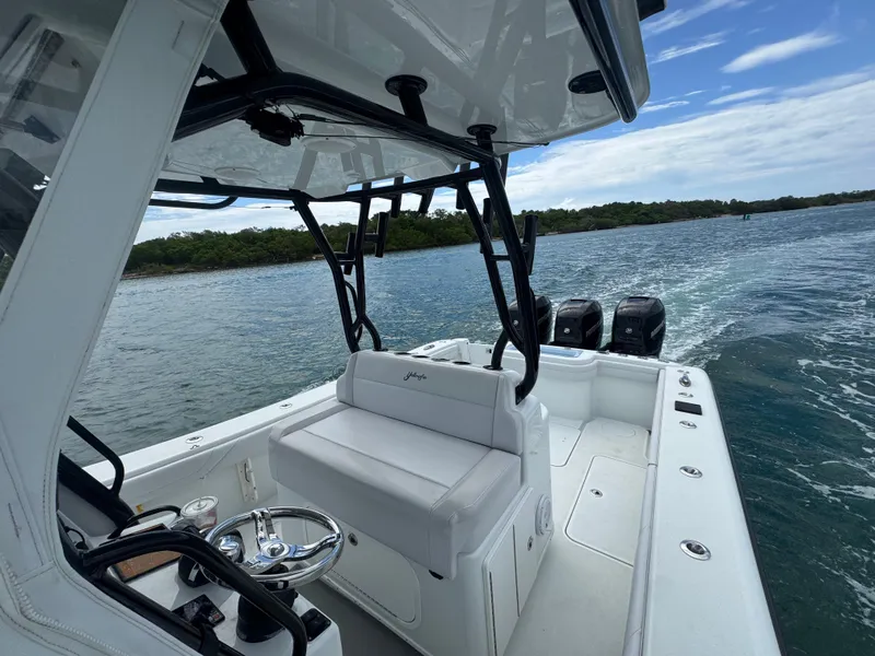 Slide: The Image of 2017 Yellowfin 36 Offshore boat cruising on open water, featuring sleek design and powerful engines. - 28