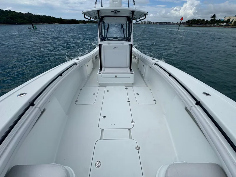 Slide: The Image of 2017 Yellowfin 36 Offshore boat deck, spacious and sleek design on open water. - 29