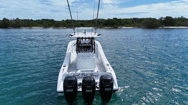 Slide: The Image of 2017 Yellowfin 36 Offshore boat with triple 350 engines on calm water. - 5